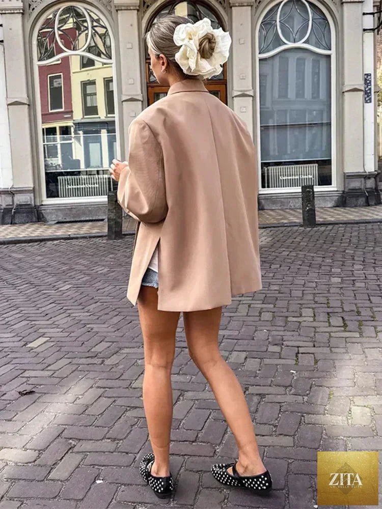 Women's Femstylo V-neck side-buttoned suit jacket with long sleeves, solid color, oversized fit, and pocket cuffs.