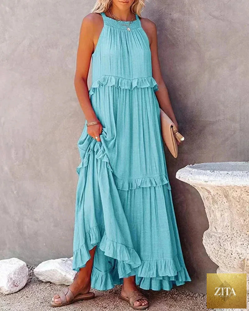Elegant apricot ruffle maxi dress by Zita La Belle Elite, featuring flowing fabric and stylish casualwear design.
