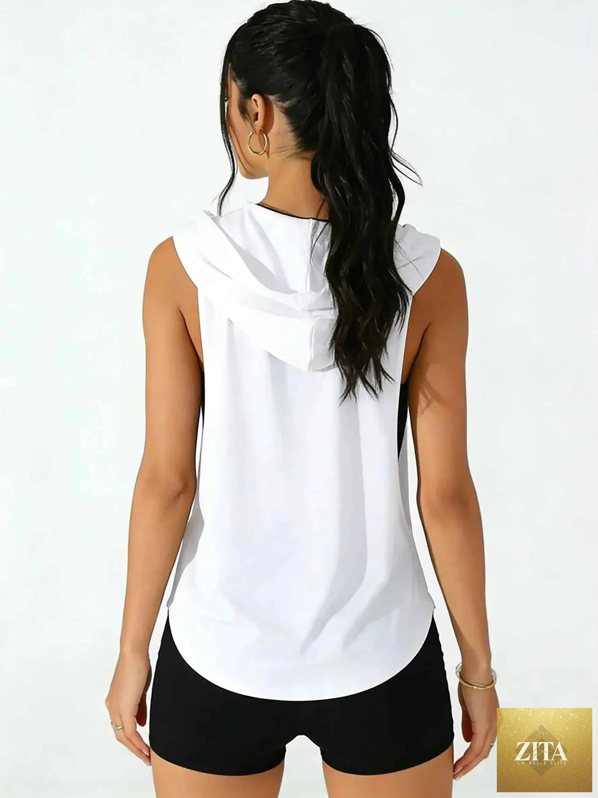 Baby girl wearing a THRIXINE cutout hooded tank top with sleeveless design and stylish cutout details.