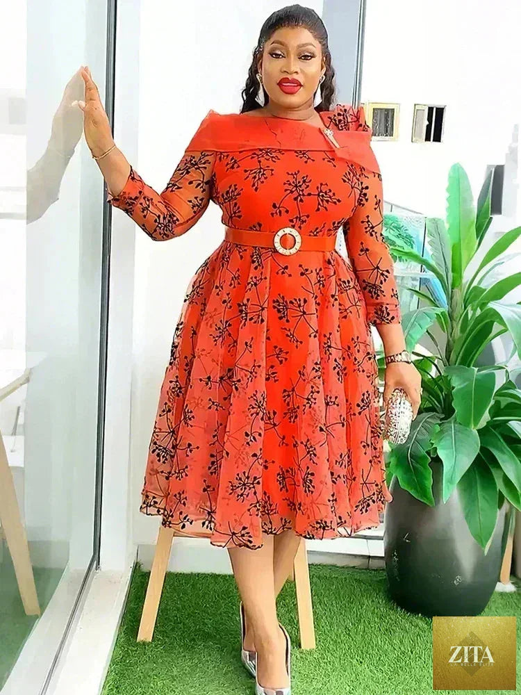 Elegant Femstylo women’s dashiki print midi dress featuring vibrant African-inspired patterns and a flowing evening gown design.