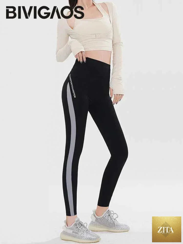 Striped shark print leggings by THRIXINE featuring a high-waist design and elastic fit for a comfortable, stylish look.