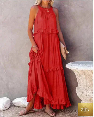 Elegant apricot ruffle maxi dress by Zita La Belle Elite, casualwear with flowing fabric and stylish ruffle details.