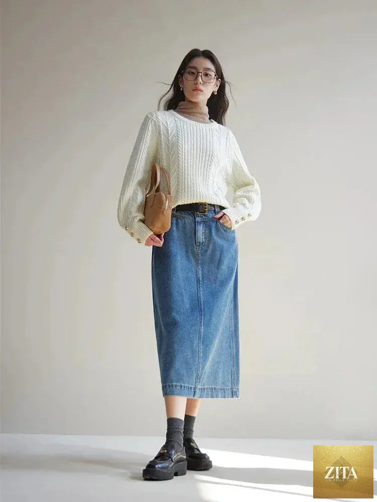 Loran gentle cable knit wool sweater in soft, cozy fabric with textured cable pattern on a neutral background.