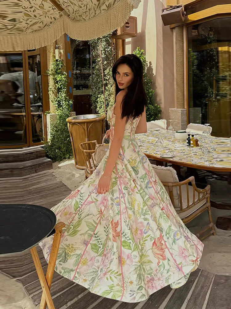 Floral print halter neck maxi dress by FLIPSTYLEZLLC featuring sleeveless design, flared hem, and elegant vacation or party style.