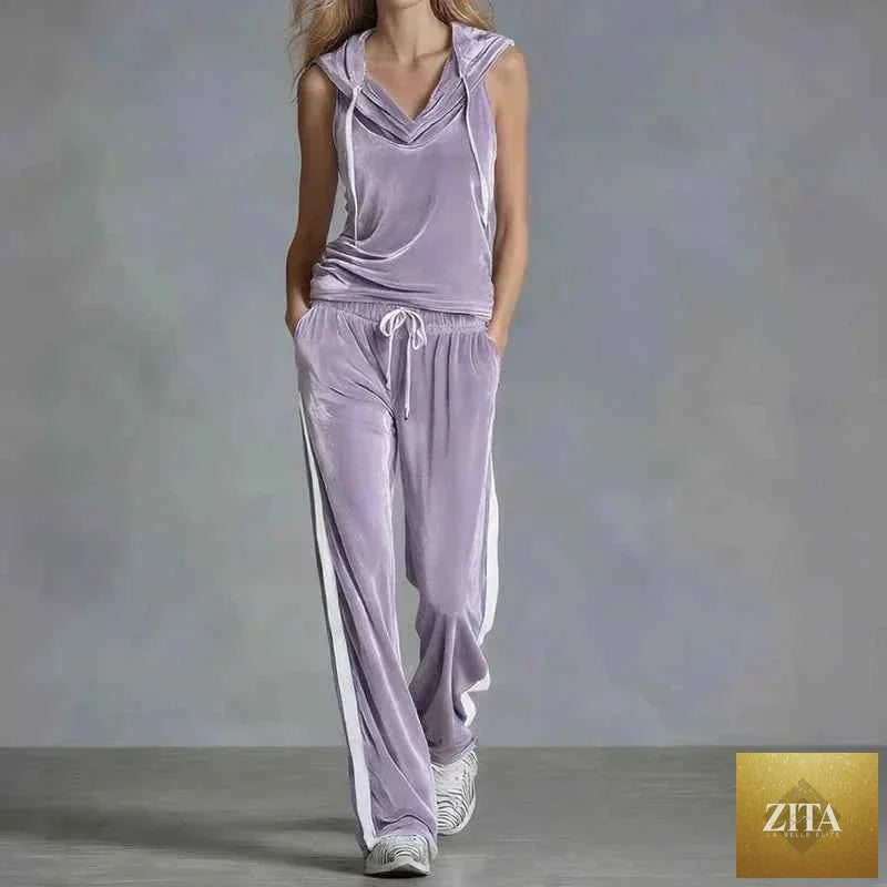 Women's velvet summer casual activewear set by THRIXINE, featuring a relaxed fit tracksuit with jacket and matching pants.