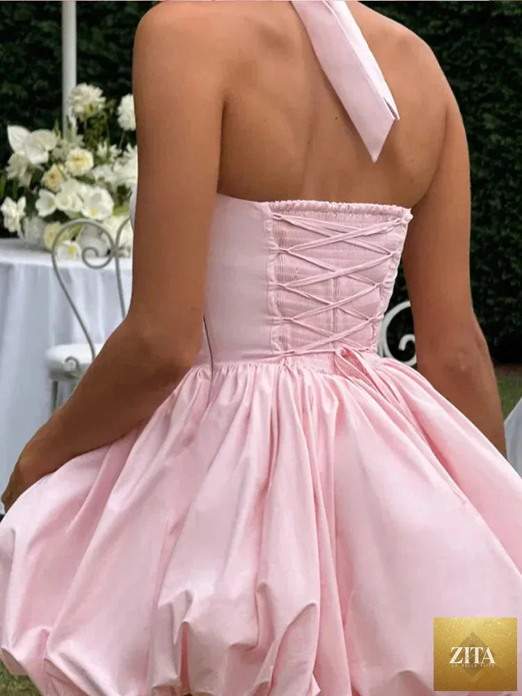 Women’s pink corset puffball-hem mini dress by Zita La Belle Elite, casualwear with a fitted corset top and flared mini skirt.