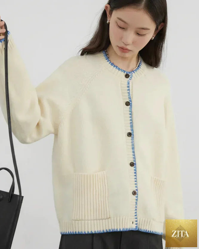 Loran contrast color cardigan sweater, loose casual knitwear with stylish color blocks, displayed on a neutral background.