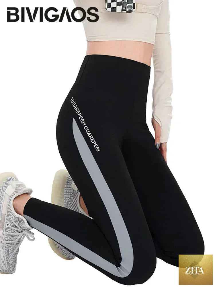 Striped Shark Butt Lift Leggings by THRIXINE featuring elastic fit and bold black and white stripes.