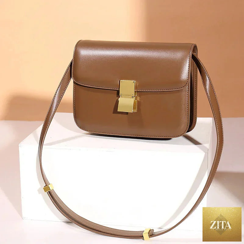 Women’s small genuine leather shoulder bag with a sleek design, featuring a compact style and smooth leather finish.
