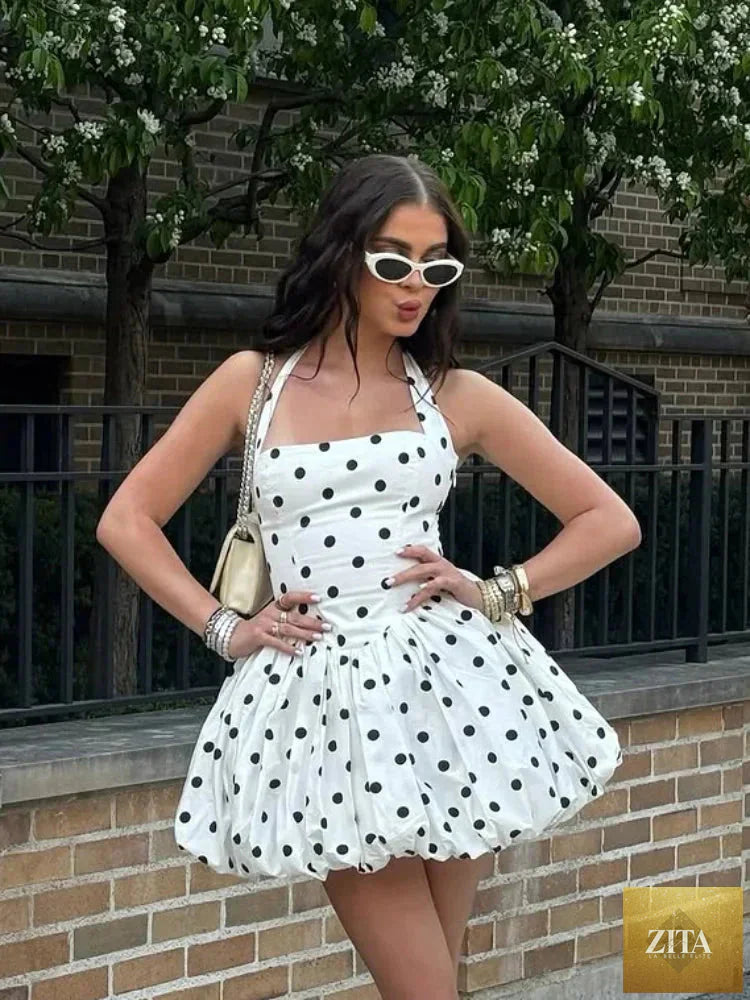 Pink women’s corset puffball-hem mini dress by Zita La Belle Elite, featuring a fitted corset top and playful puffball hem.