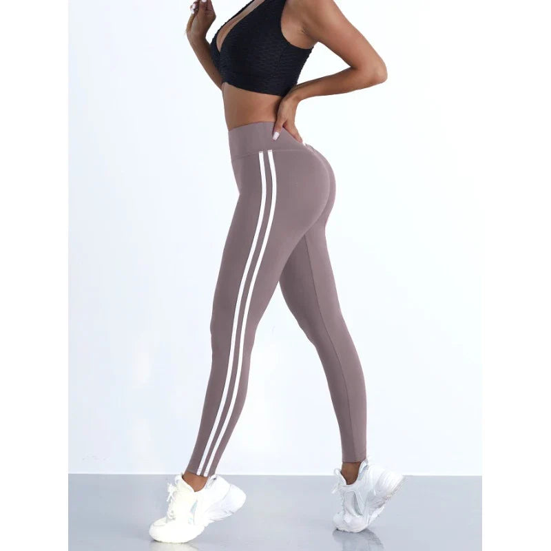 Women's striped yoga leggings by 24 Hour Sport, featuring a comfortable fit and stylish design for active wear.