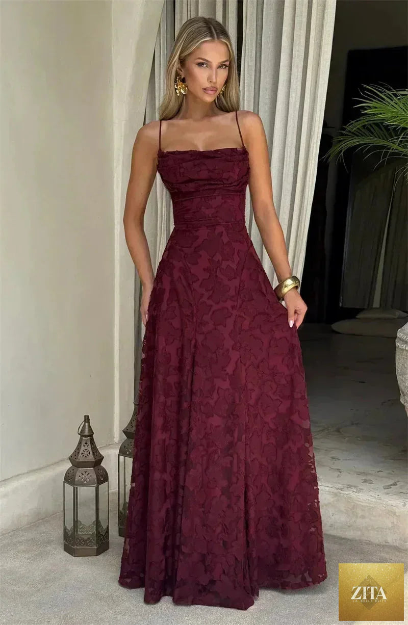Femstylo women's backless spaghetti strap maxi dress with lace-up design, off-shoulder, sleeveless gown for evening or party wear.