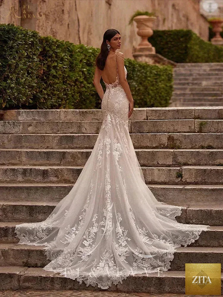 Femstylo Luvury lace wedding dress with spaghetti straps, beach bridal gown, perfect for wedding and party occasions.