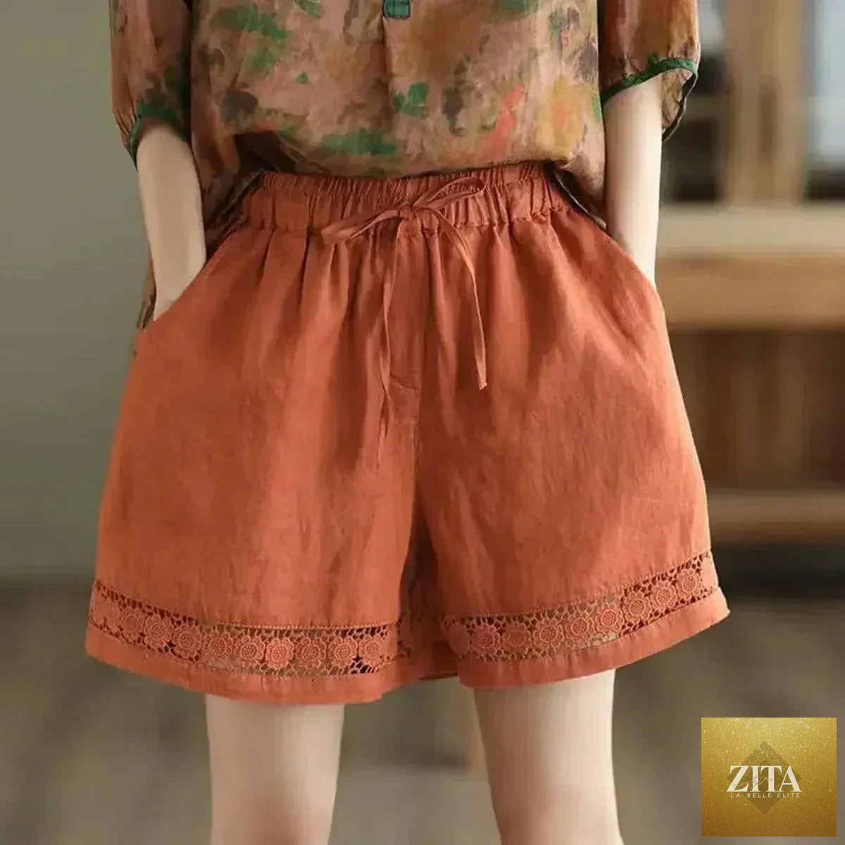 Cotton linen vintage high-waist shorts by Femstylo featuring tie-belt, embroidered hollow design, and casual straight fit.