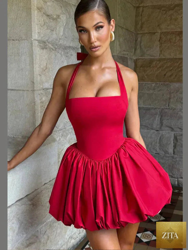 Women’s pink corset mini dress with puffball hem, casualwear by Zita La Belle Elite, shown on a model.
