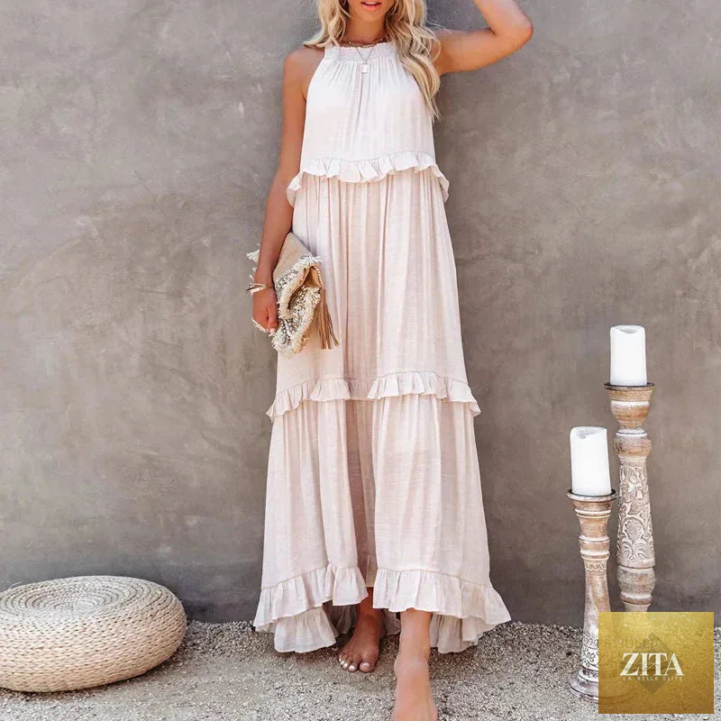 Elegant apricot ruffle maxi dress by FitiqueFit featuring flowing fabric and casualwear style, perfect for warm weather outings.