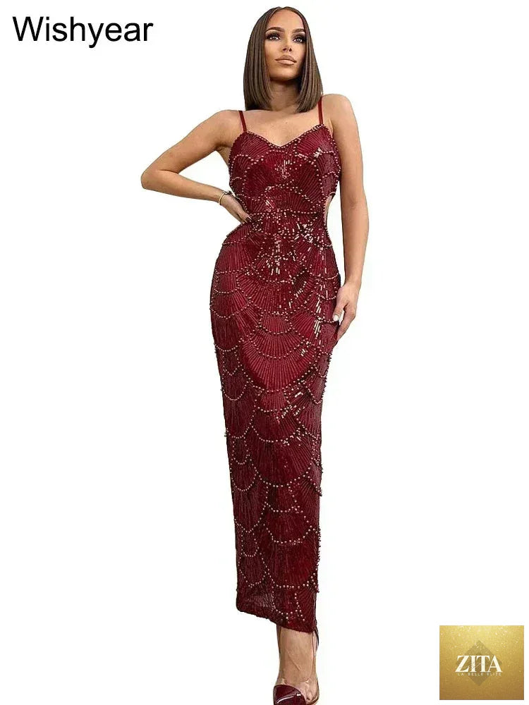Elegant women’s backless mermaid dress by Femstylo with sequin hollow-out design, spaghetti straps, suitable for evening and wedding events.