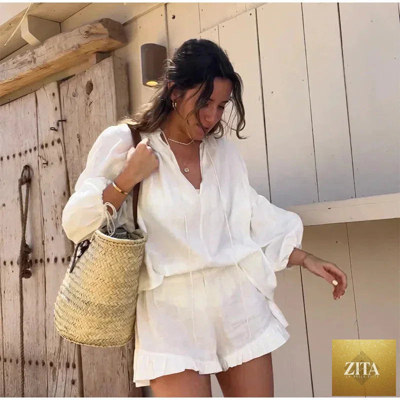 Women's cotton linen ruffle shorts suit with V-neck long sleeves and drawstring waist, featuring a loose, two-piece design.