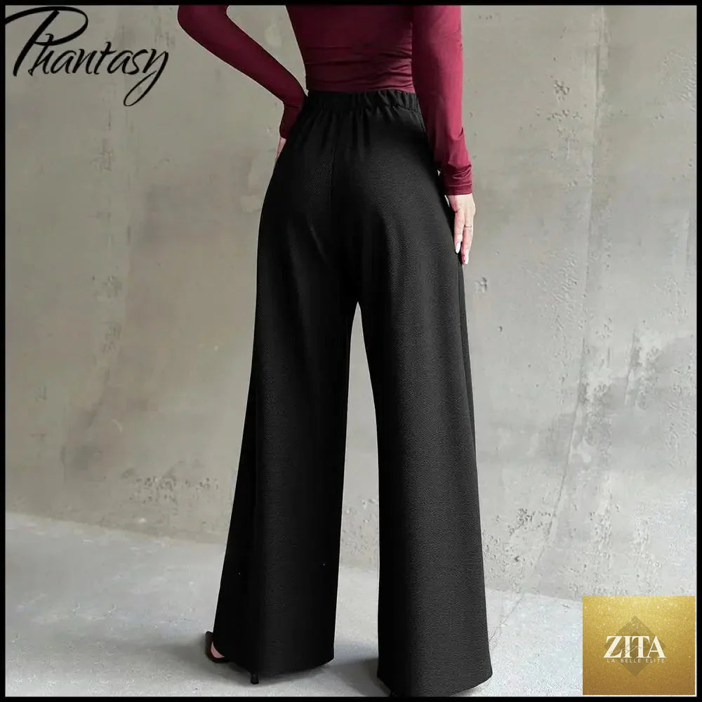 Black high-waisted suit pants for women by Ladyez, slim-fit, straight-leg, versatile workwear for spring and autumn.