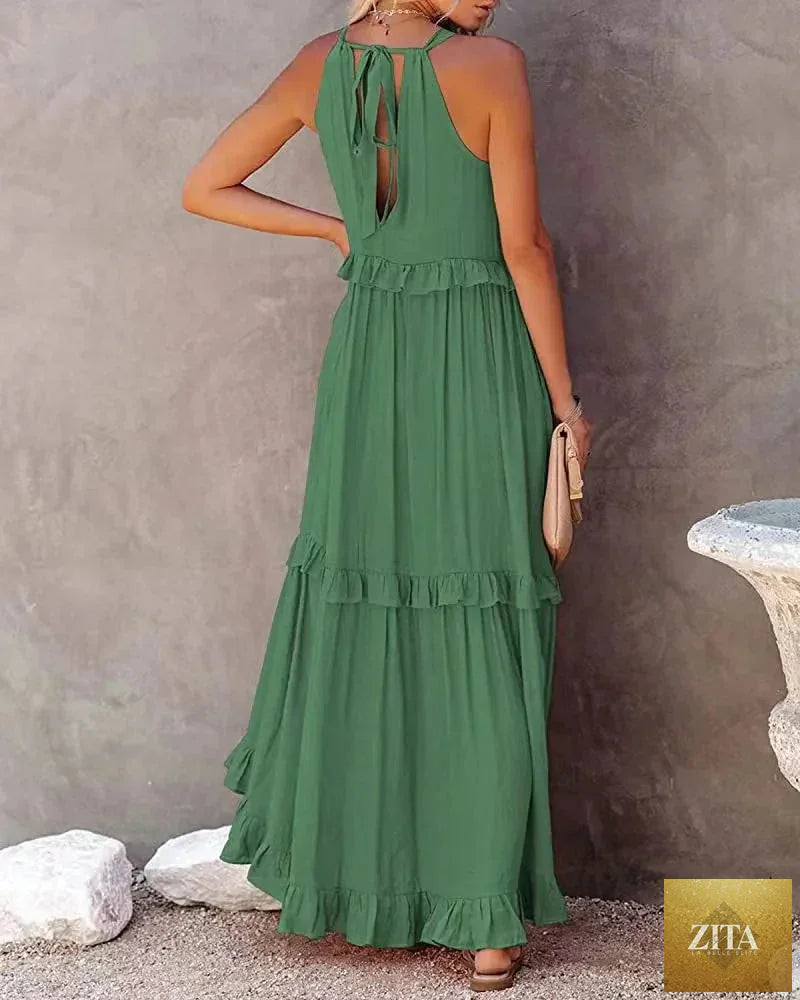 Elegant apricot ruffle maxi dress by Zita La Belle Elite, casualwear with flowing fabric and layered ruffle details.