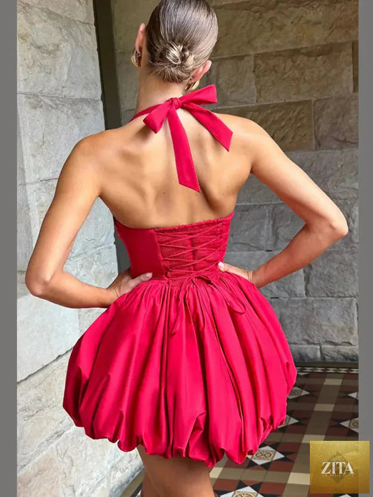 Pink women’s corset puffball-hem mini dress by Zita La Belle Elite, casualwear style with fitted bodice and playful hem detail.