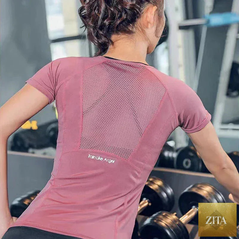 Plus size women's breathable sports T-shirt by Zita La Belle Elite, ideal for yoga and running, shown in black fabric.
