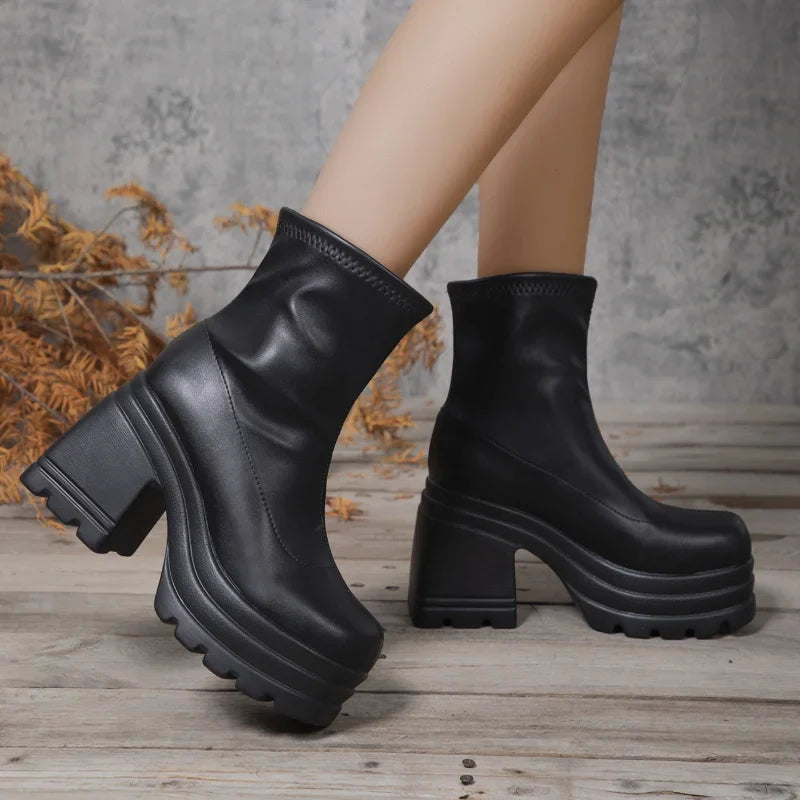 Women’s black leather short boots with square toes, high heels, zipper front, and thick soles, perfect for casual and fashionable looks.