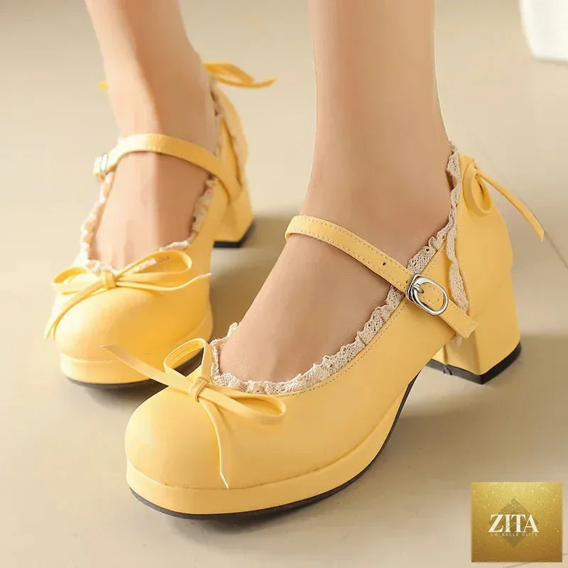 Women's Lolita cosplay Mary Jane pumps with strap, platform block heel, lace details, and bow, available in plus size.