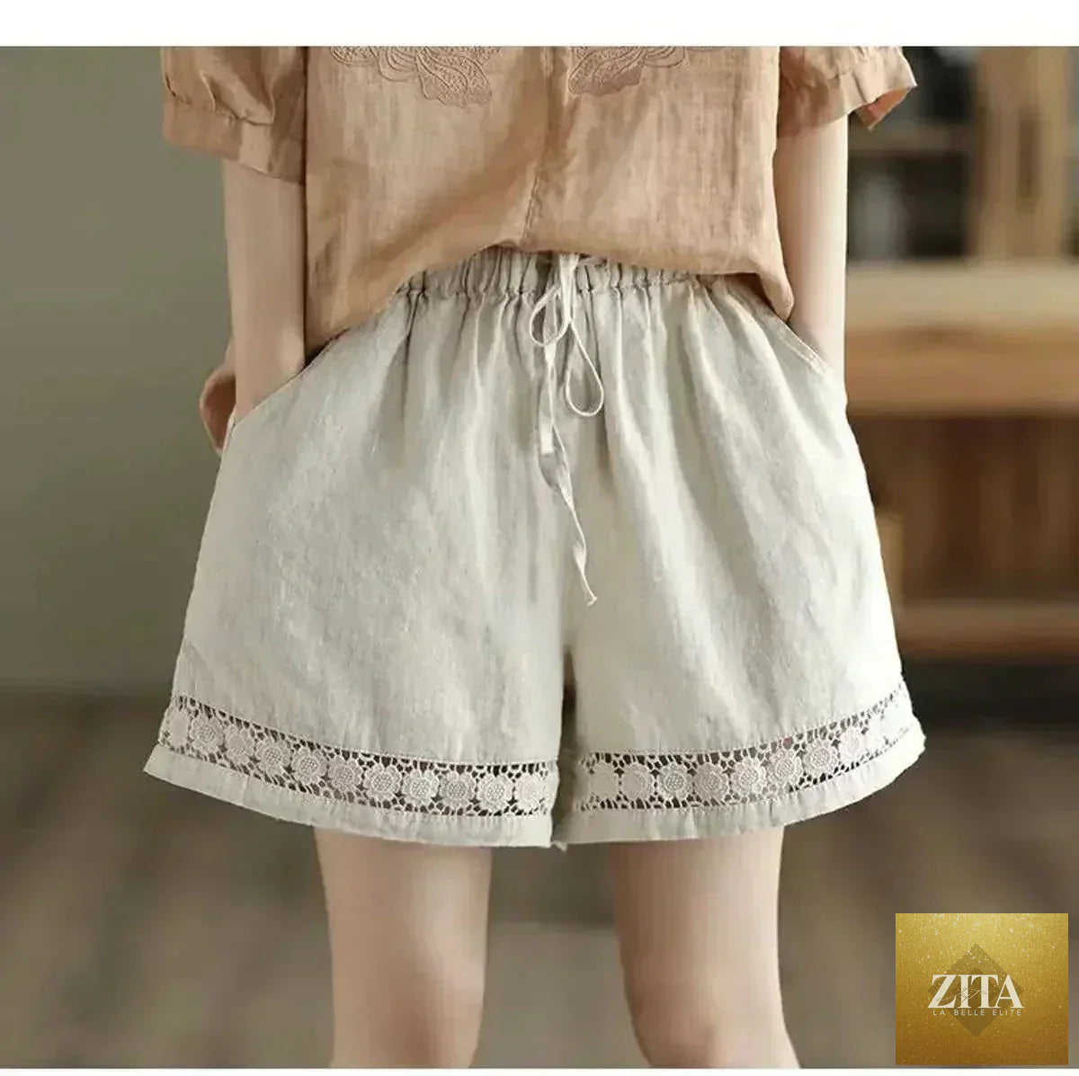 Femstylo cotton linen vintage high-waist shorts with tie-belt, embroidered hollow design, casual straight fit, elastic waistband.
