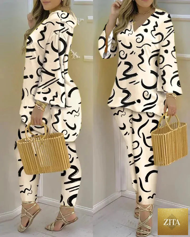 Women’s long sleeve V-neck polyester two-piece set with printed design, stylish and comfortable for casual wear.
