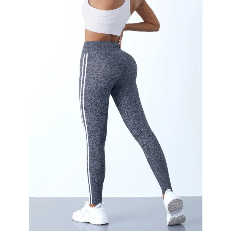 Women's striped yoga leggings from 24 Hour Sport, comfortable stretchable pants suitable for exercise and casual wear.