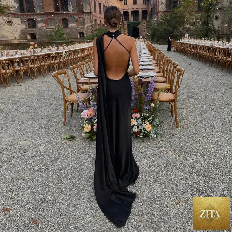 Femstylo backless lace-up maxi dress with sleeveless ribbon detail, elegant party gown for evening occasions.