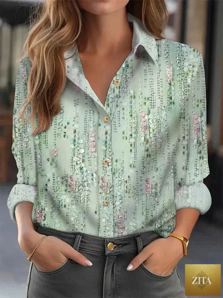 Women’s elegant loose printed blouse by THRIXINE, stylish active top with floral pattern, lightweight fabric, and relaxed fit.