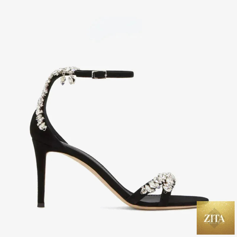 Black women's stiletto high heels with rhinestone embellishments, open toe design, slotted buckle, and round toe sandals by SHOMICOBOUTIQUE.