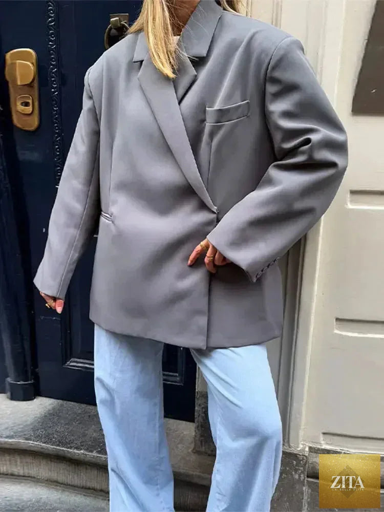 Women's Femstylo V-neck side-button suit jacket with long sleeves, solid color, oversized fit, pockets, and cuff details.