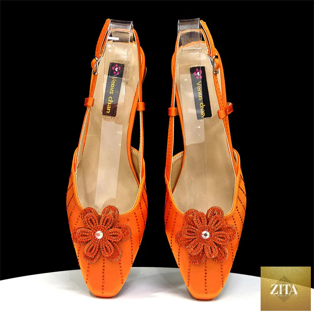 Elegant women's Italian fashion heels and clutch bag set by EdleessFashion, featuring sophisticated design and luxurious details.