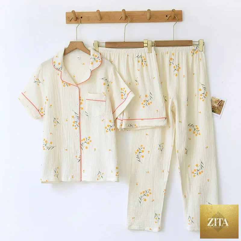 Large size women's cotton crepe pajama set with short sleeves, shorts, and trousers featuring simple floral patterns.