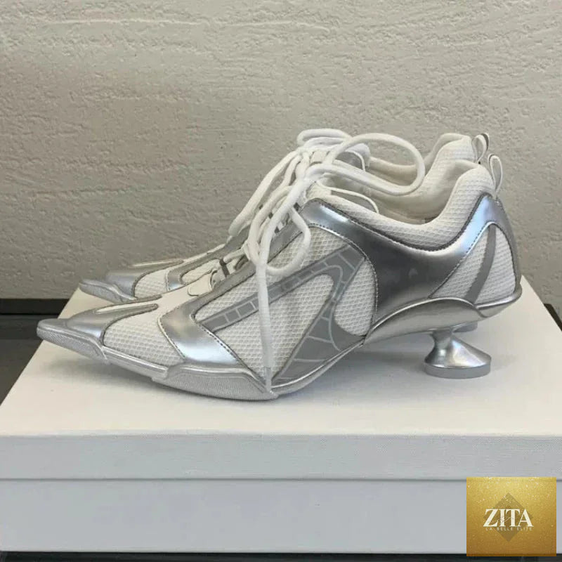Silver lace-up women's sports heels with pointed toes, mesh design, and elegant punk style for fashionable women.