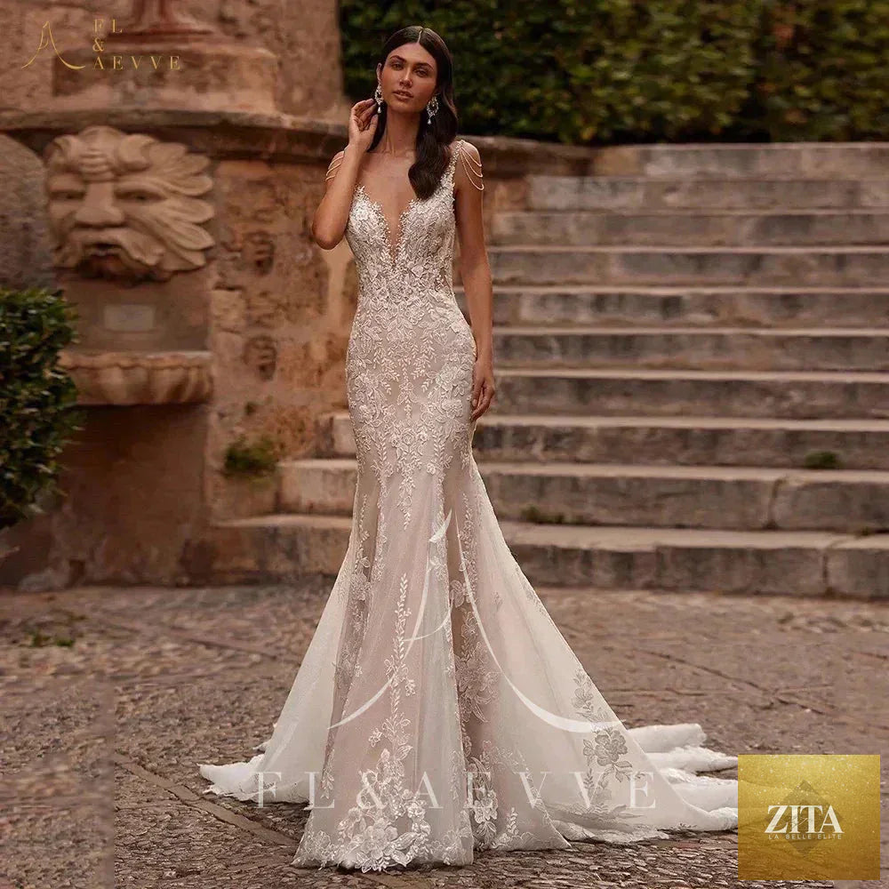 Femstylo Luvury Lace Wedding Dress with spaghetti straps, beach bridal gown, perfect for wedding and party celebrations.