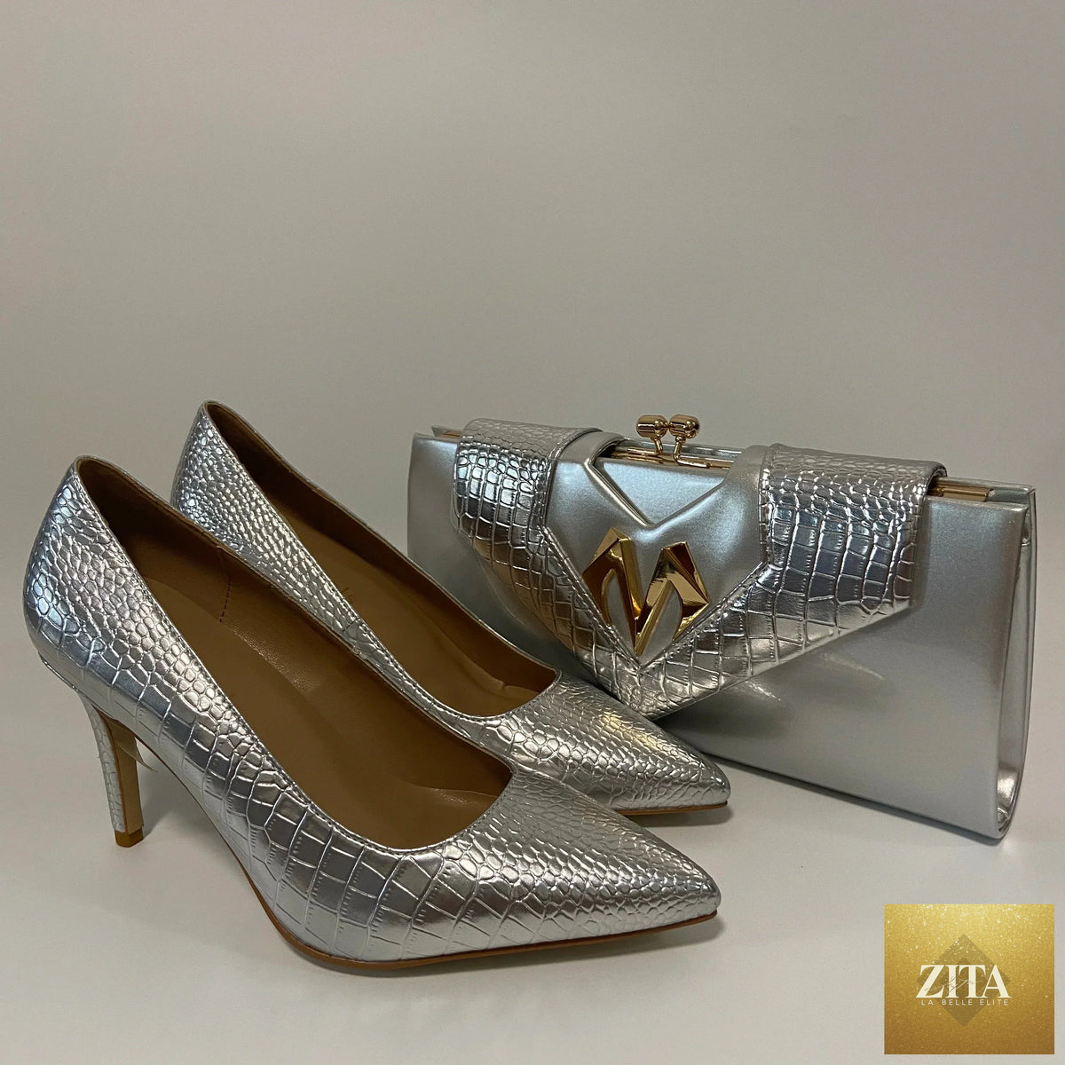 Elegant high heel shoes and matching bag by EdleessFashion, featuring stylish design and sophisticated details for formal occasions.
