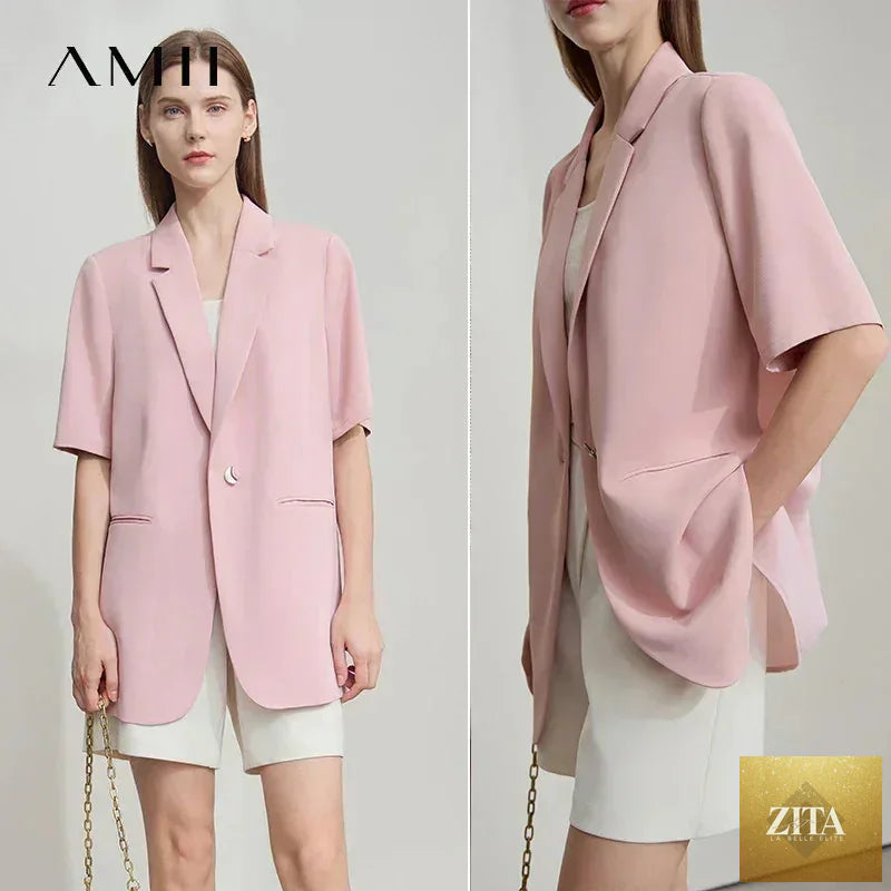 Femstylo Amii Women's minimalist short sleeve blazer with notched lapel, contrast patchwork, and one-button closure.