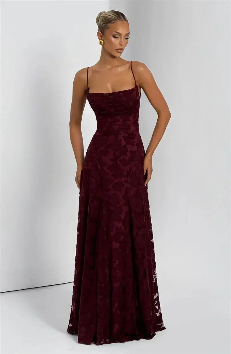 Femstylo backless spaghetti strap maxi dress featuring off-shoulder lace-up design, sleeveless style, perfect for evening or party wear.