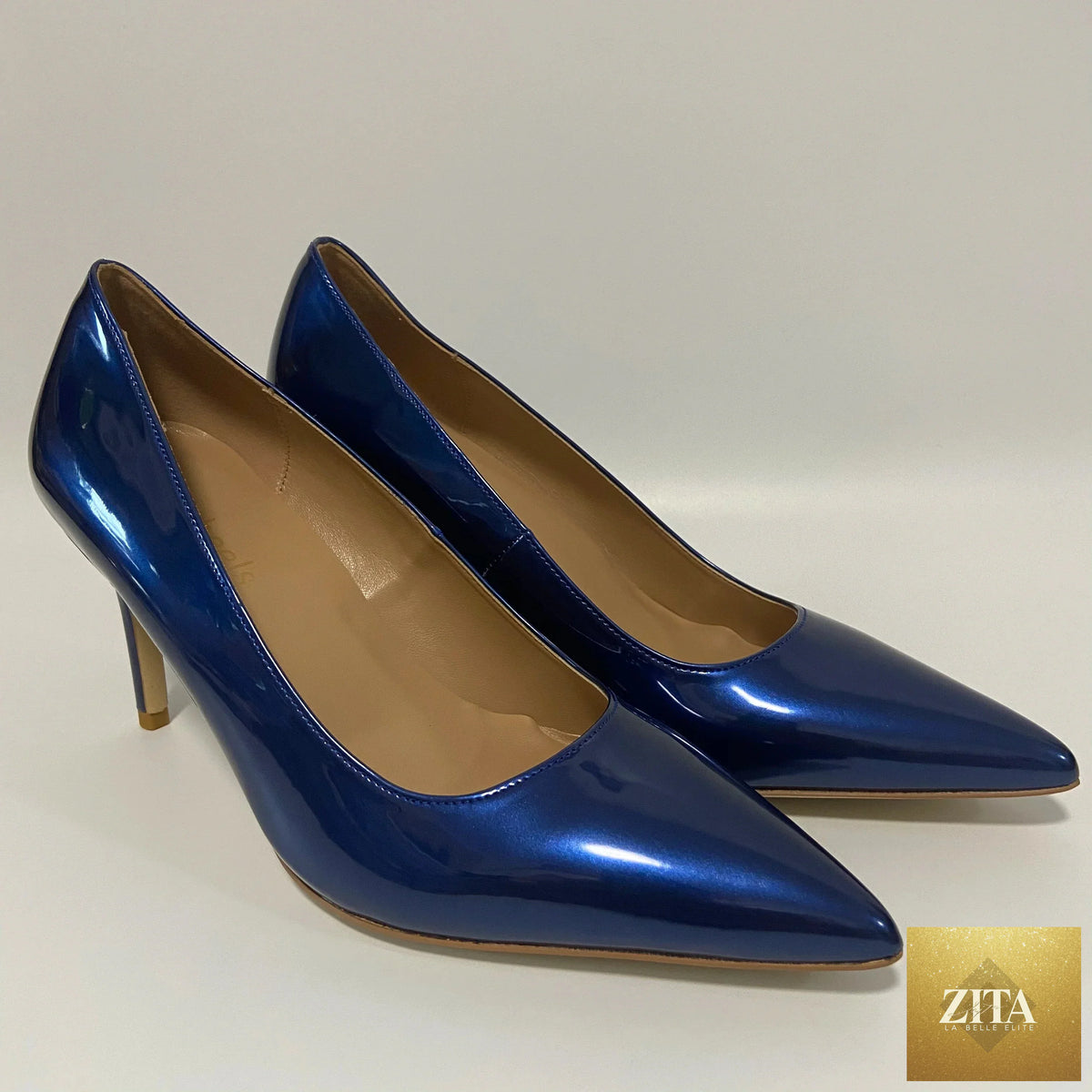 Elegant high heel shoes and matching bag by EdleessFashion, showcasing stylish footwear and accessories for sophisticated looks.