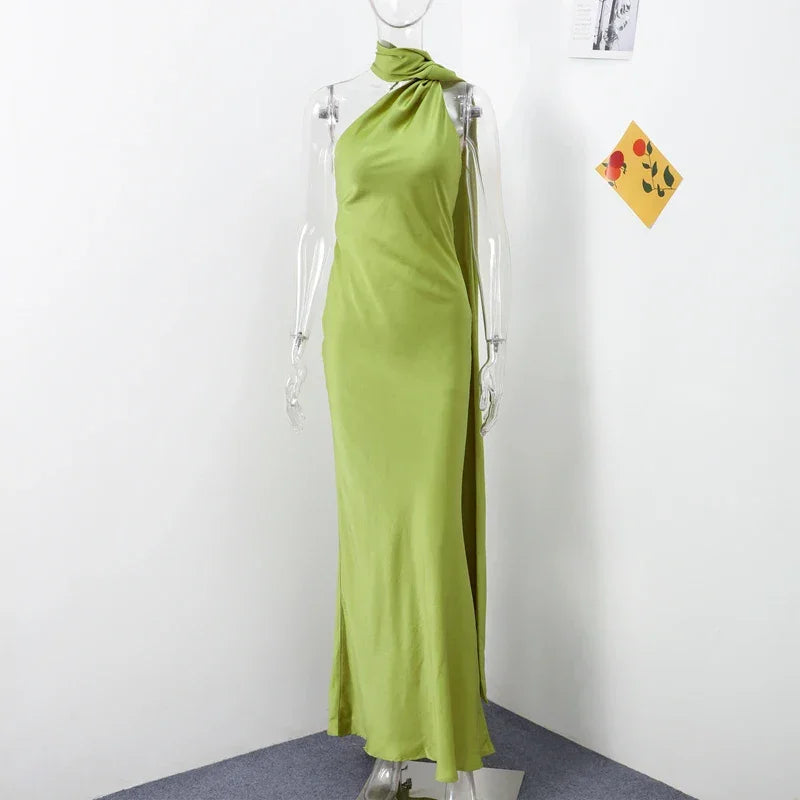 Backless lace-up maxi dress by Femstylo featuring sleeveless design, elegant ribbon accents, perfect for evening parties.