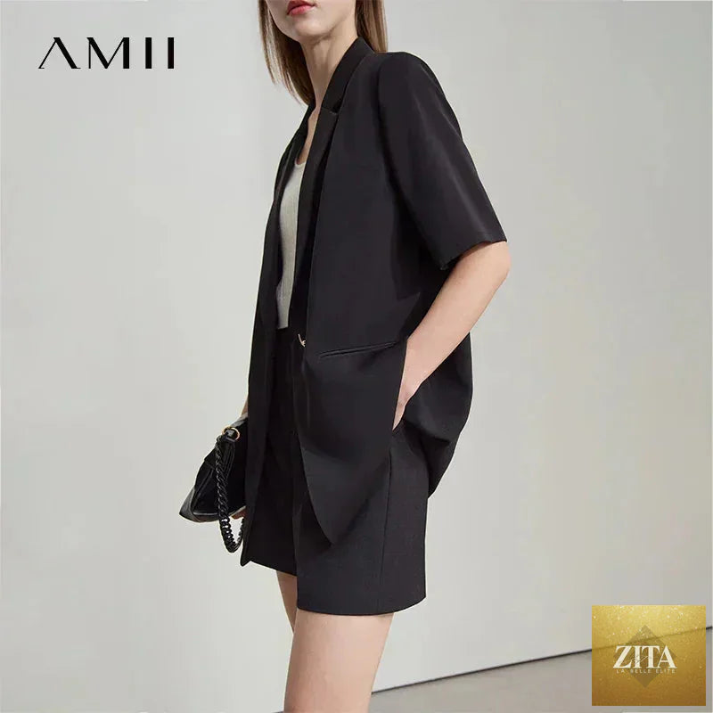 Femstylo Amii Women's minimalist summer blazer with notched lapel, contrast patchwork, short sleeves, and one-button closure.