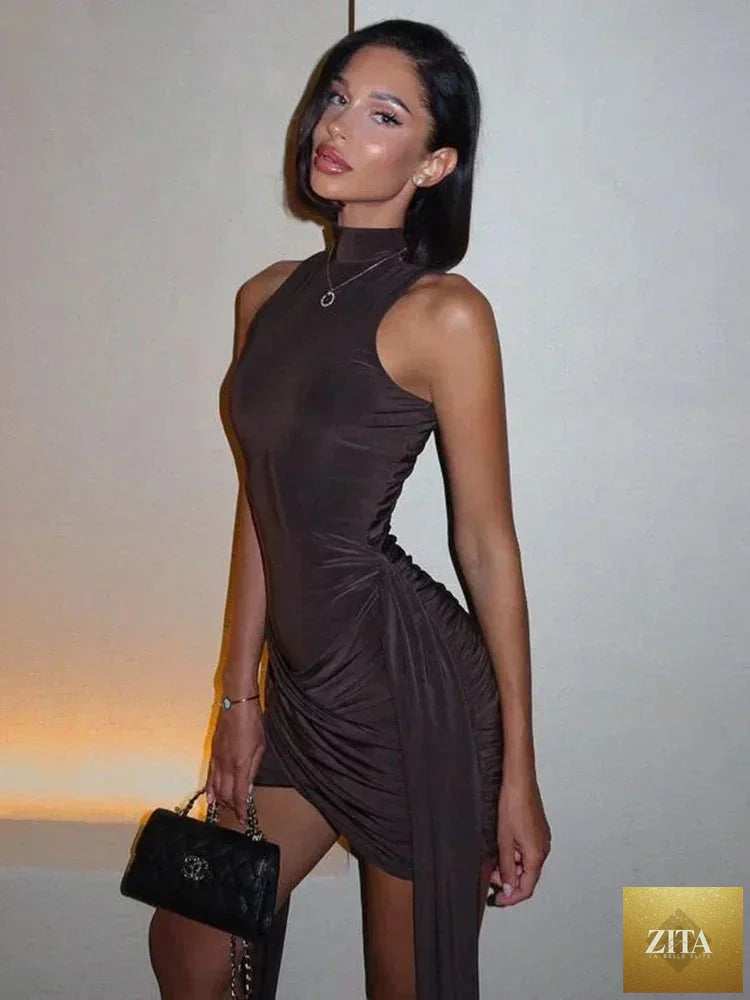 Femstylo sleeveless turtleneck mini dress with ruched, asymmetrical design, perfect for parties and stylish occasions.