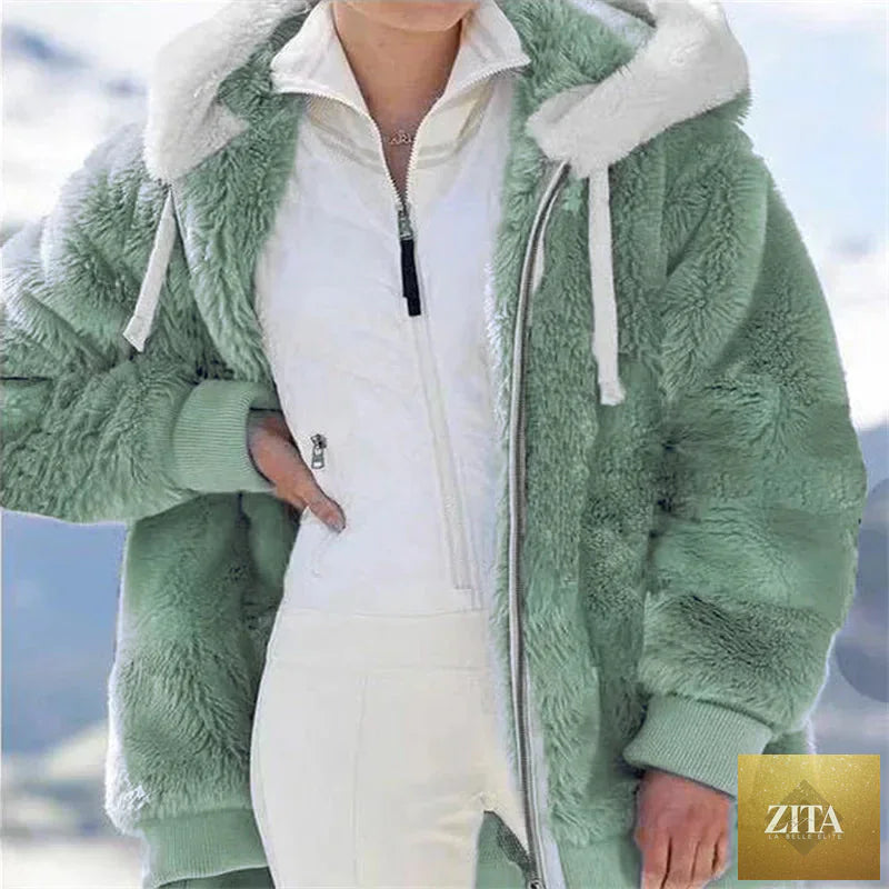 Warm women's faux fur winter jacket with plush fleece lining, hood, zipper, and casual style, perfect for cold weather.