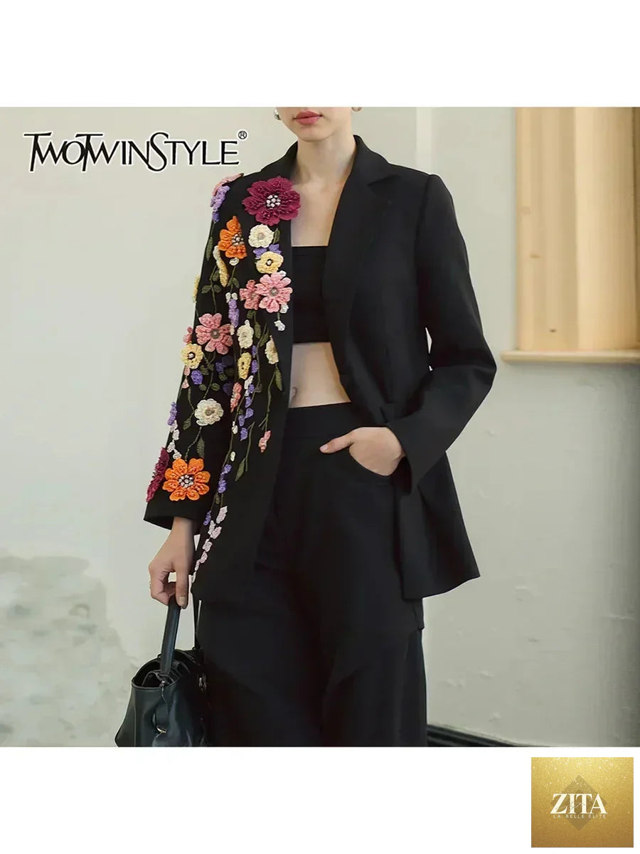 Women’s fashion blazer by Femstylo featuring hit color spliced appliques, lapel, long sleeves, and patchwork bead detailing.