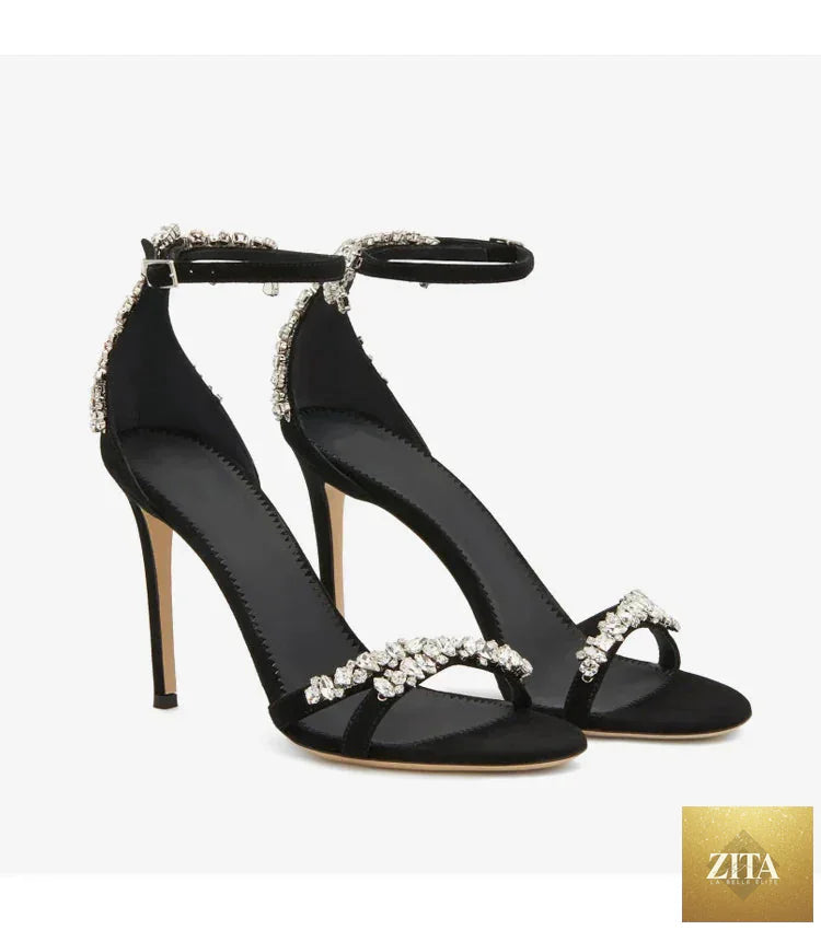 Black women's stiletto high heels with rhinestones, open toe, round toe design, featuring a slotted buckle for a celebrity style look.