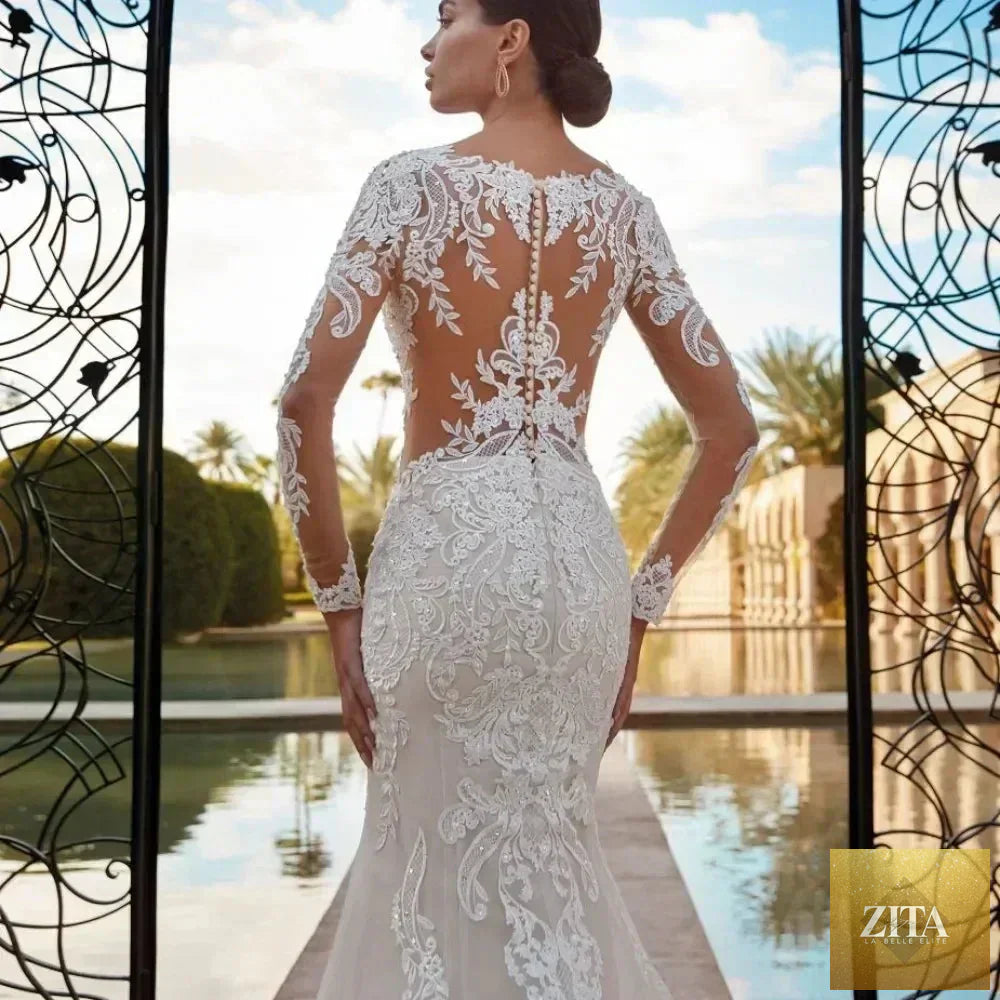 Elegant boho mermaid wedding dress by Femstylo featuring long lace sleeves and customizable fit, perfect for bridal occasions.